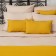 A mustard blanket with a contrasting edging Essential, size 230x250 cm