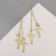 Earrings hanging "rustle" crosses, color mix, 8.5 cm