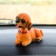 Dog on a car panel shocking his head, SP15