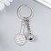 Breek Metal "Game of tennis - rocket and ball" silver 7x2.5 cm