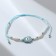 Bracelet-reinforcing “thread of desires” Hams's hand, white blue color