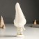 Polystone souvenir "Baby in a white outfit with a snowflake, with a gift/bell" MIX 7x6x18 cm 94988