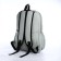 School backpack from textiles on a zipper, 3 pockets, green color