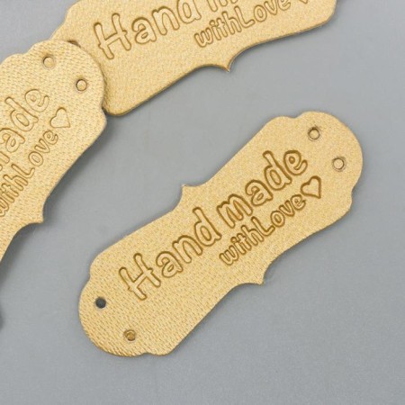 Handmade tag, leather, color gold 1.5x4 cm