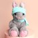 Soft toy Bunny with a hat and scarf