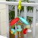 Musical pendant "Sunny Polyanka" on a crib/stroller