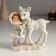 Polystone souvenir "Baby with white deer" 12x6x13 cm