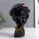 Polystone souvenir "Baby with lily in her hair and butterfly" Black 23x17x7 cm