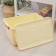 Storage container with a lid 50 l, 59 × 39 × 32 cm, on wheels, ivory color