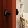 Plastic door handle, d = 65, black with a pattern