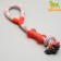 A training cable toy with a bone, up to 120 g, up to 40 cm, mix of flowers