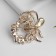 Brooch "Pearl Wreath" with a bow, brown color in gold