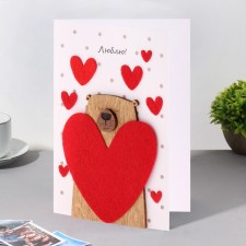 A postcard with a wooden element 