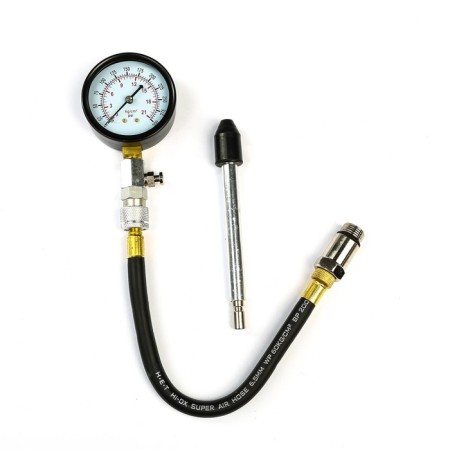 A compressometer for gasoline engines with 2 adapters in the case