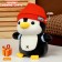 Soft toy "Penguin" with a backpack, in a red hat, 22 cm