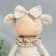 Interior doll "Baby with a bow in hair, with a flower" 35x13.5x20 cm