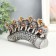 Polystone souvenir "Five elephants on a tusk with flowers" silver 17x4x8 cm