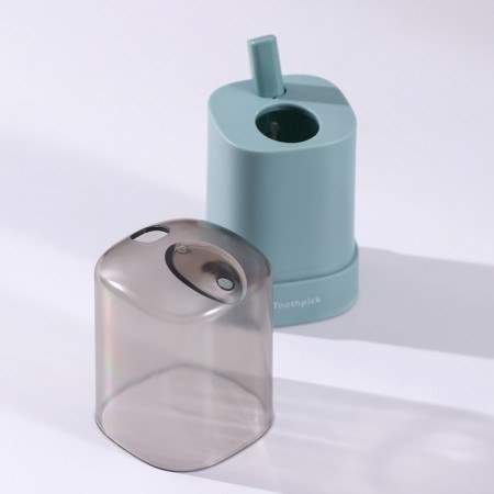 The dispenser for toothpicks is automatic, the color is green-1