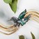 Brooch "Galiotis" hummingbirds, green color in black silver
