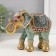 Souvenir Polystone "Elephant, chamomile on the Propon" red-blue, sparkle 15x6x12.5 cm