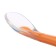 A spoon for a nursery, for the first feeding, in a container, orange