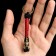A keychain - a launcher for a spartan knife from a paracord, black -red, bead - bronze