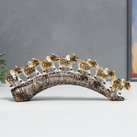 Polystone souvenir "Seven white elephants with a blanket from the Arab carpet on a horn" 11.5x31x5 cm