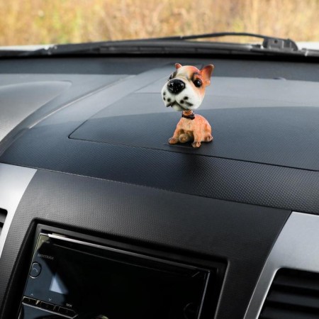 Dog on a car panel shocking his head, a mongrel-1
