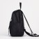 A backpack with a zipper, "saxi", outer pocket, black color