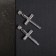 Earrings with rhinestones "crosses" stripes, white color in silver