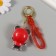 Trick rubber with carbine, panda strap in the red sweatshirt 5.5x4x3.5 cm