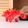 Soft musical toy "Dinosaurus", 27 cm, red color
