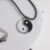 Yin-Yang pendant, black and white color in silver, on a black lace, 42 cm