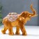 Polystone souvenir "African elephant with a flower on a blanket" under a bronze of 12.5x7x14 cm