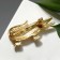 Brooch "Crocodile", black color in gold