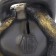 The piggy bank "Snake with weights" is black, 25 cm