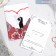 A wedding invitation in the postcard "newlyweds", red