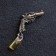 Talisman keyhole "Revolver", natural amber