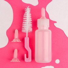 A set for feeding puppies and kittens (a bottle of 60 ml, nipple and ruff)