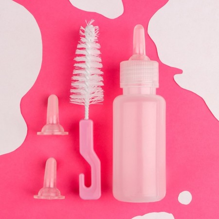 A set for feeding puppies and kittens (a bottle of 60 ml, nipple and ruff)