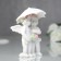 Polystone souvenir "Angels under an umbrella in pink wreaths" 8.5x6.7x6.5 cm