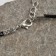 Piece on the cord "Feather", color black silver on a black lace, 45 cm