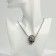 Pendant "Skull" with a pattern, color black silver, 70 cm