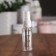 A bottle for storage, with a spray, with a division scale, 20 ml, white/transparent color
