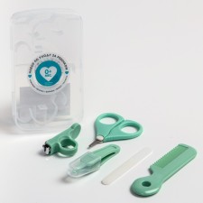 A child’s care set, 5 items (comb, tweezers, scissors, a knipser, saw), green color