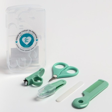 A child’s care set, 5 items (comb, tweezers, scissors, a knipser, saw), green color
