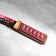 The souvenir is wooden "Tanto knife", in the scabbard, pink