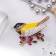 Brooch "Bird Sinichka", colored yellow in gold
