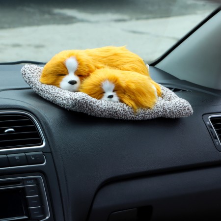 A toy on a car panel, dogs on a pillow, white-red color-3