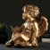Climb "Angel sitting in his hand" 26x21x30 cm bronze, for a candle d = 6 cm